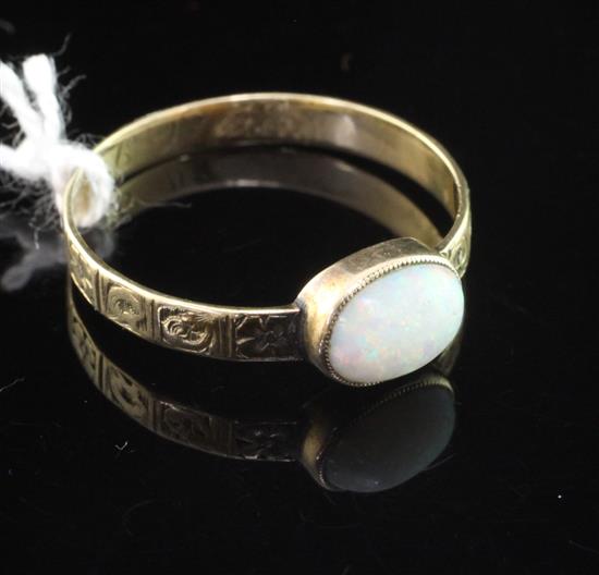 An antique gold and white opal ring, size S.